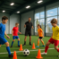 Youth soccer players training on an indoor field with a coach instructing during a passing drill