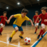 Young futsal players in action on an indoor court during a competitive match