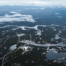 Aerial view of Alaska's remote terrain showing scattered settlements and vast distances between communities
