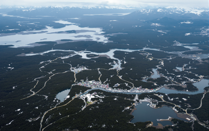 Aerial view of Alaska's remote terrain showing scattered settlements and vast distances between communities