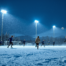 Teenage soccer players practicing on a snowy floodlit field at dusk in an Alaskan winter